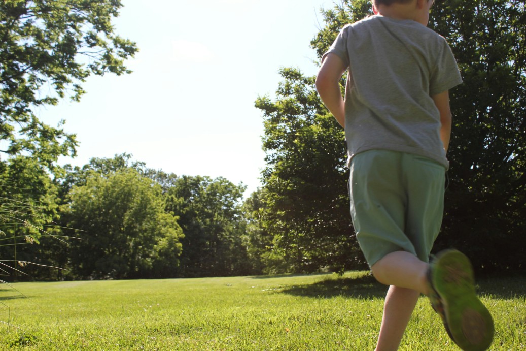 Child running through a nearby park